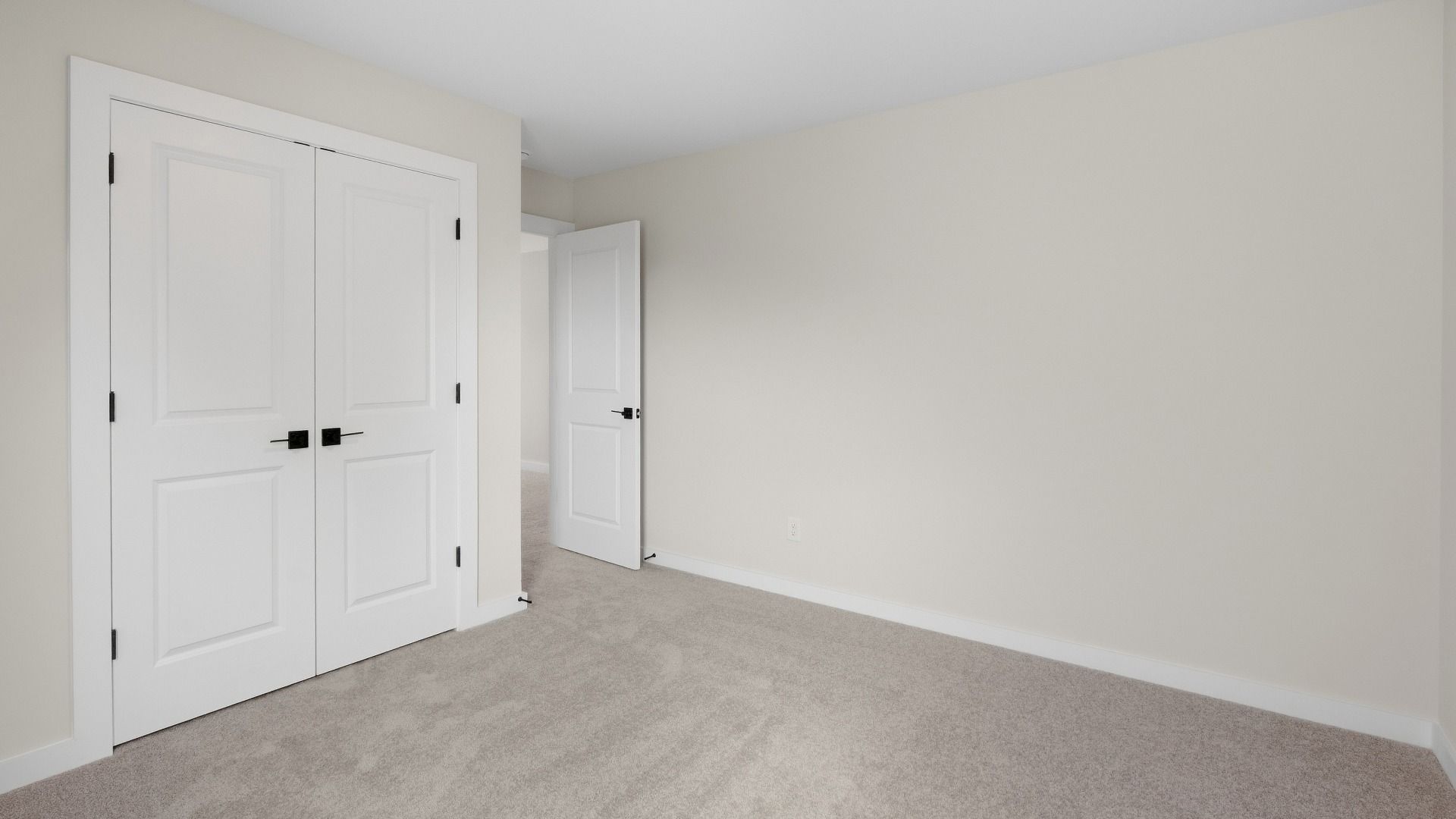 Secondary bedroom with double door closet