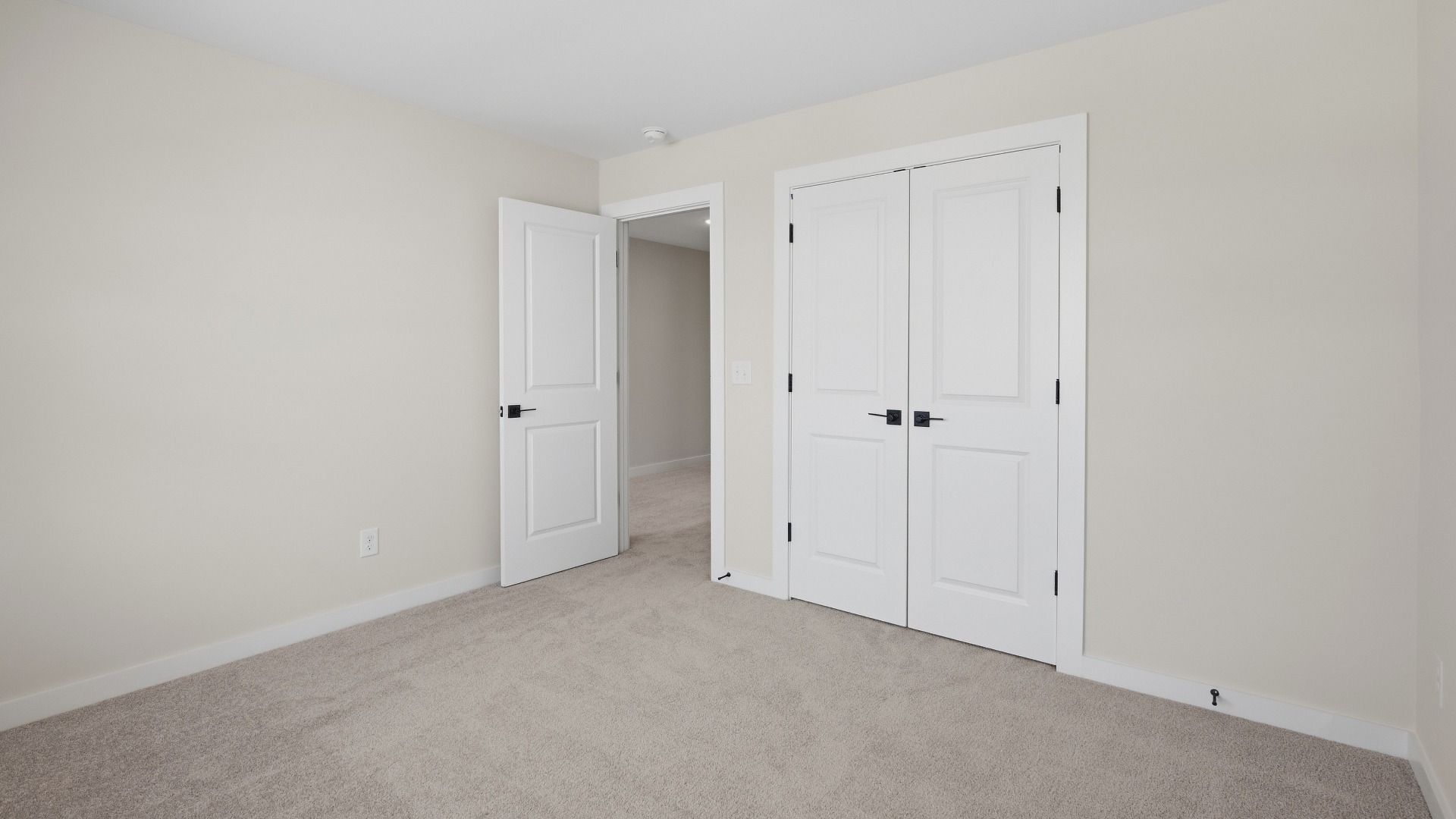 Secondary bedroom with double door closet