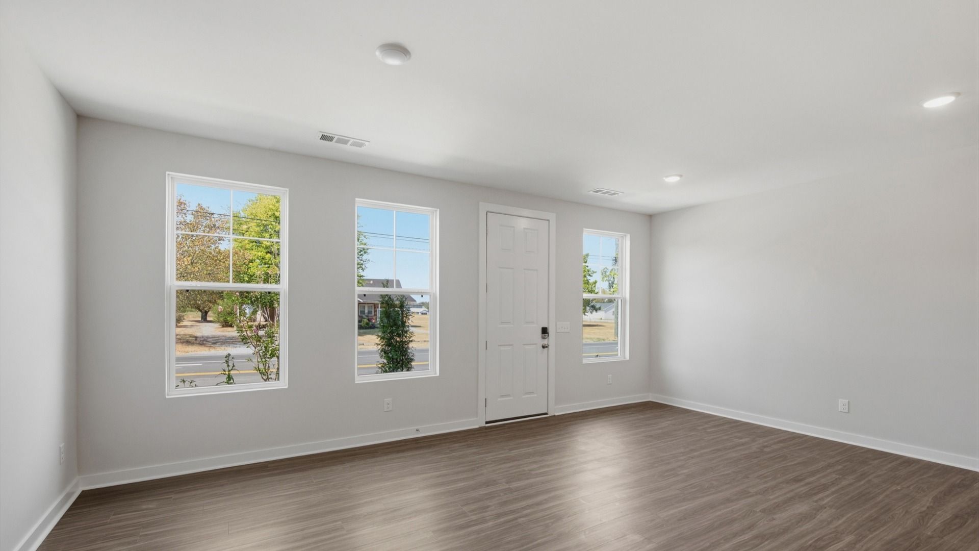 Front door with windows into spacious entryway