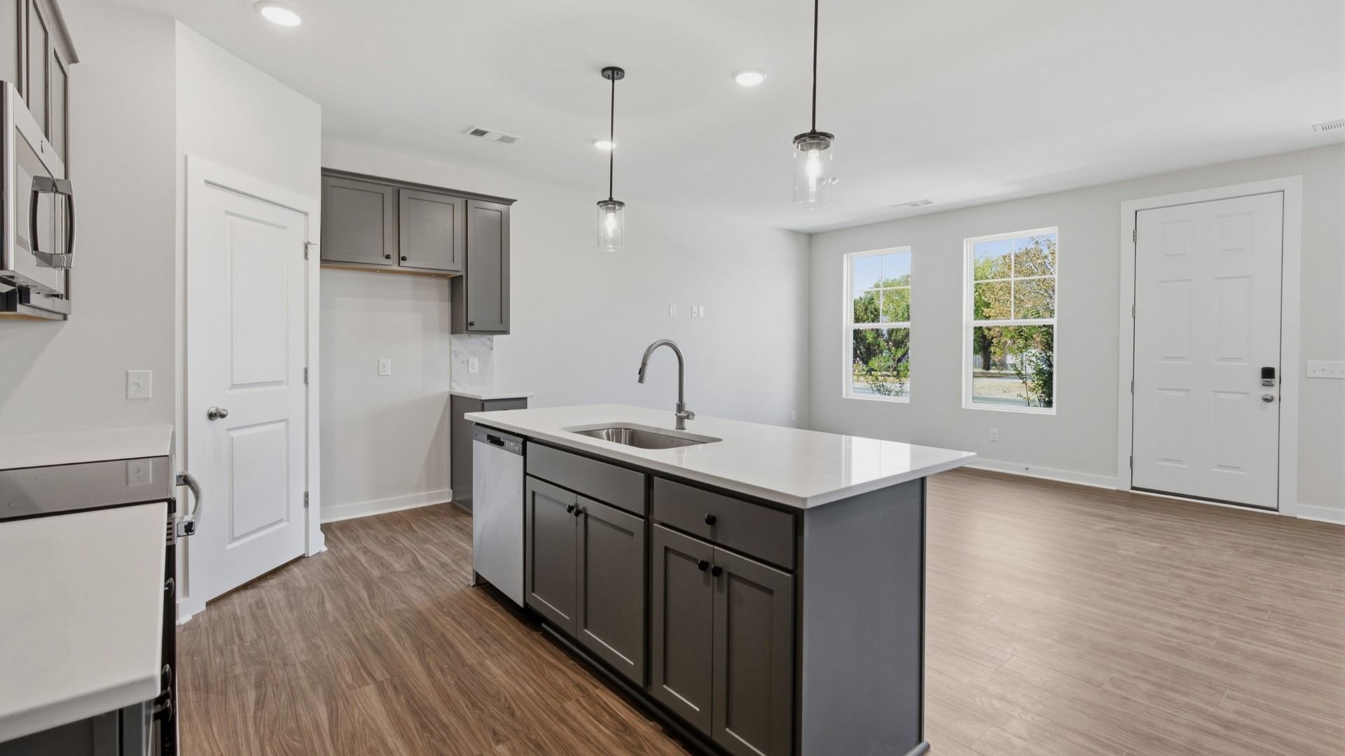Modern lighting with hanging lights over kitchen island for an elevated feel