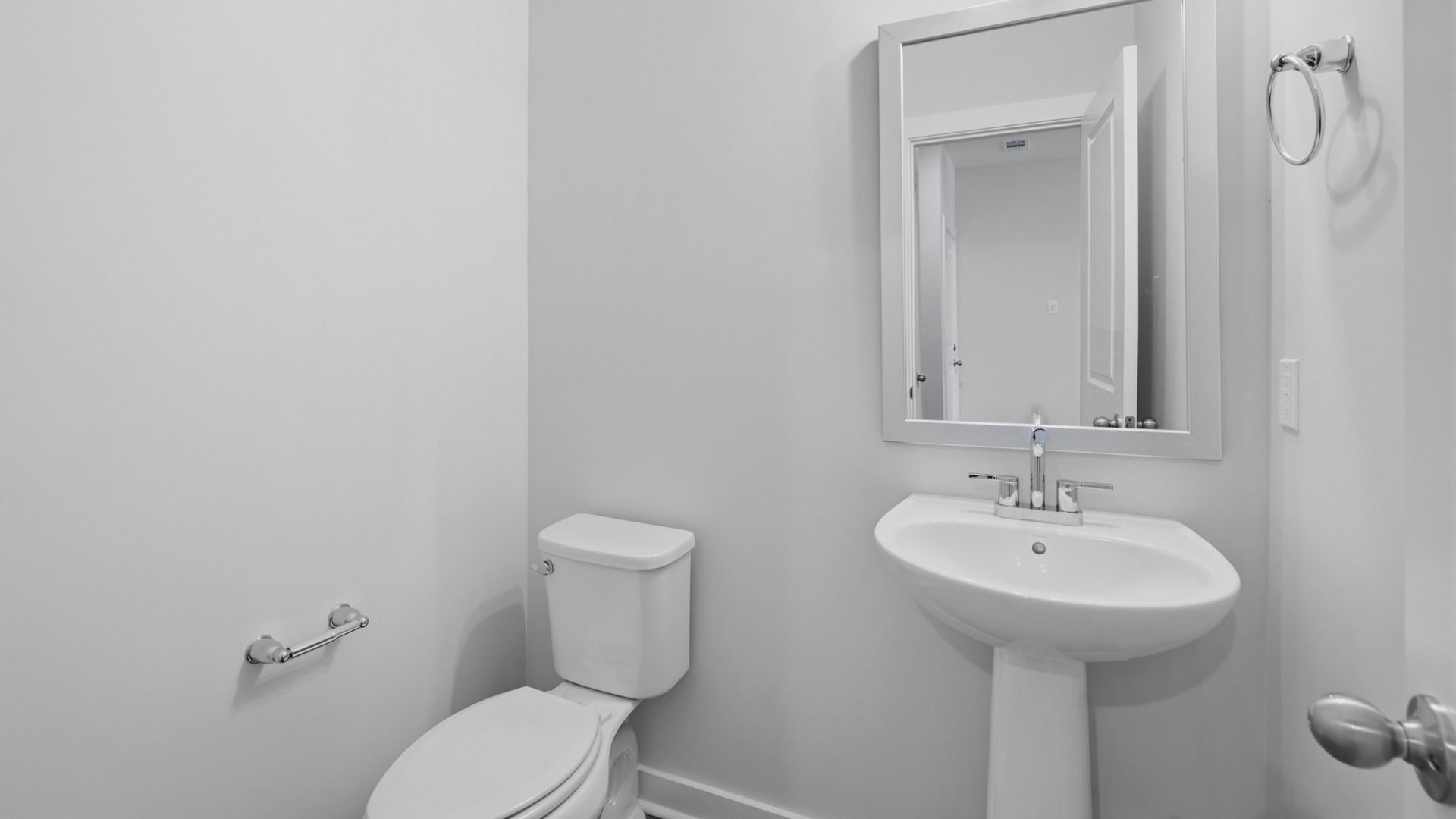 Bathroom with mirror above sink