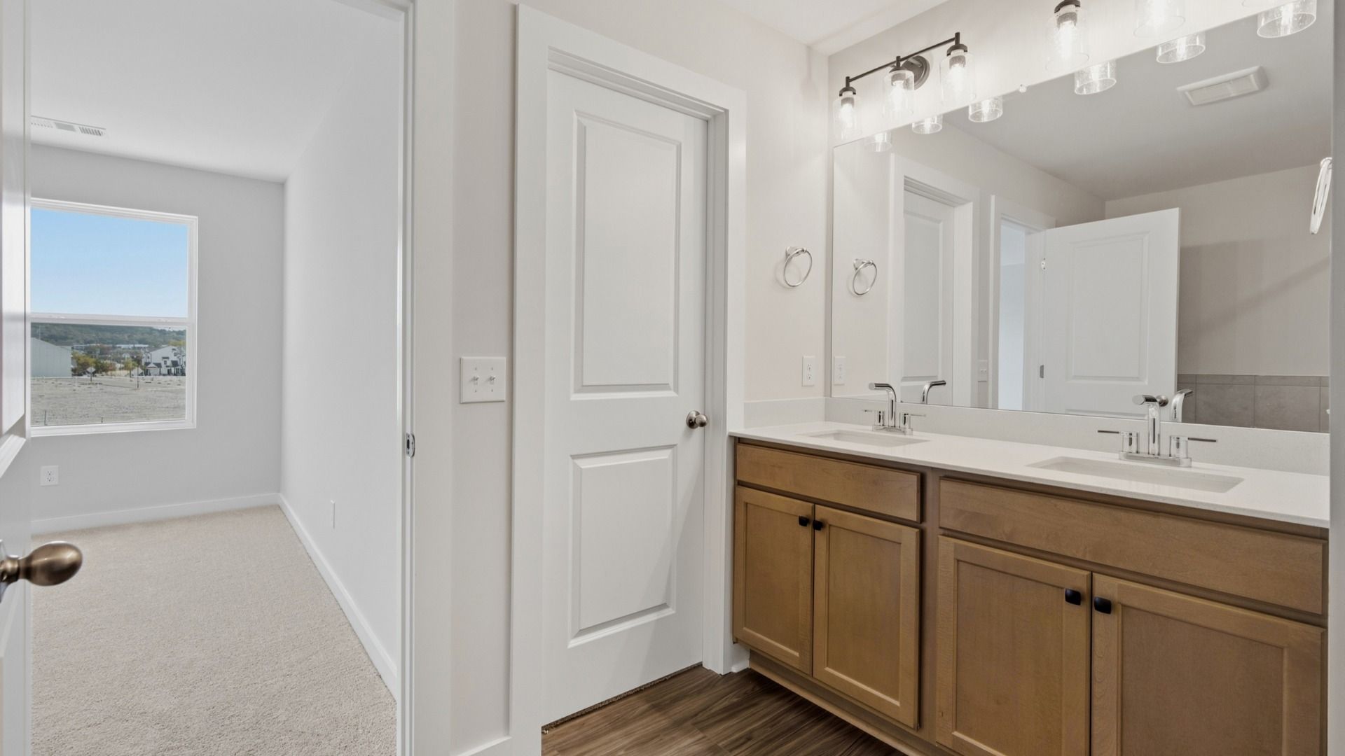 Primary bathroom with elevated features such as dual vanities