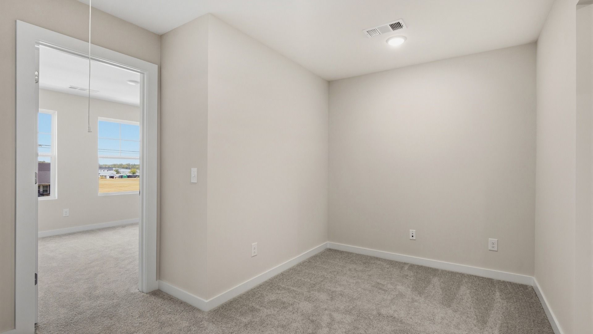 Living space next to primary bedroom