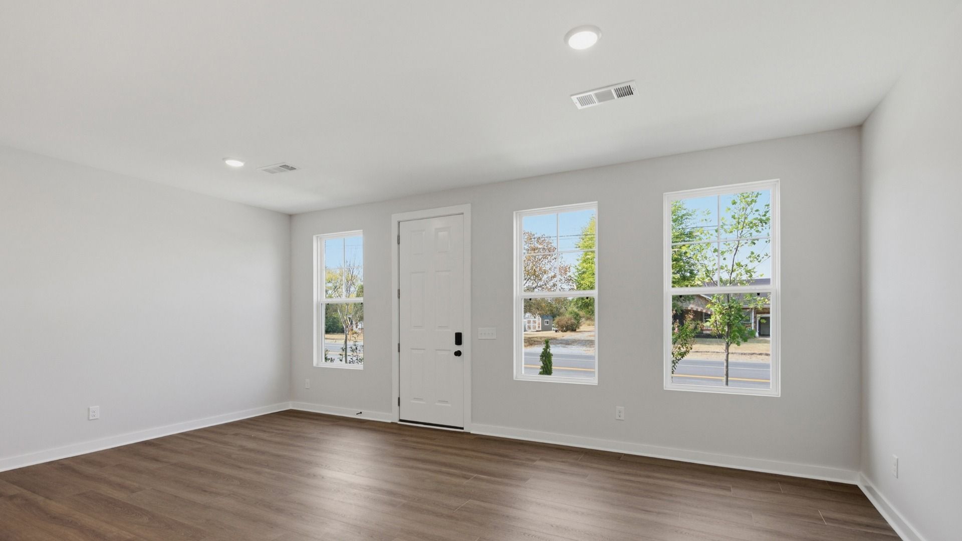 Front door with windows into spacious entryway