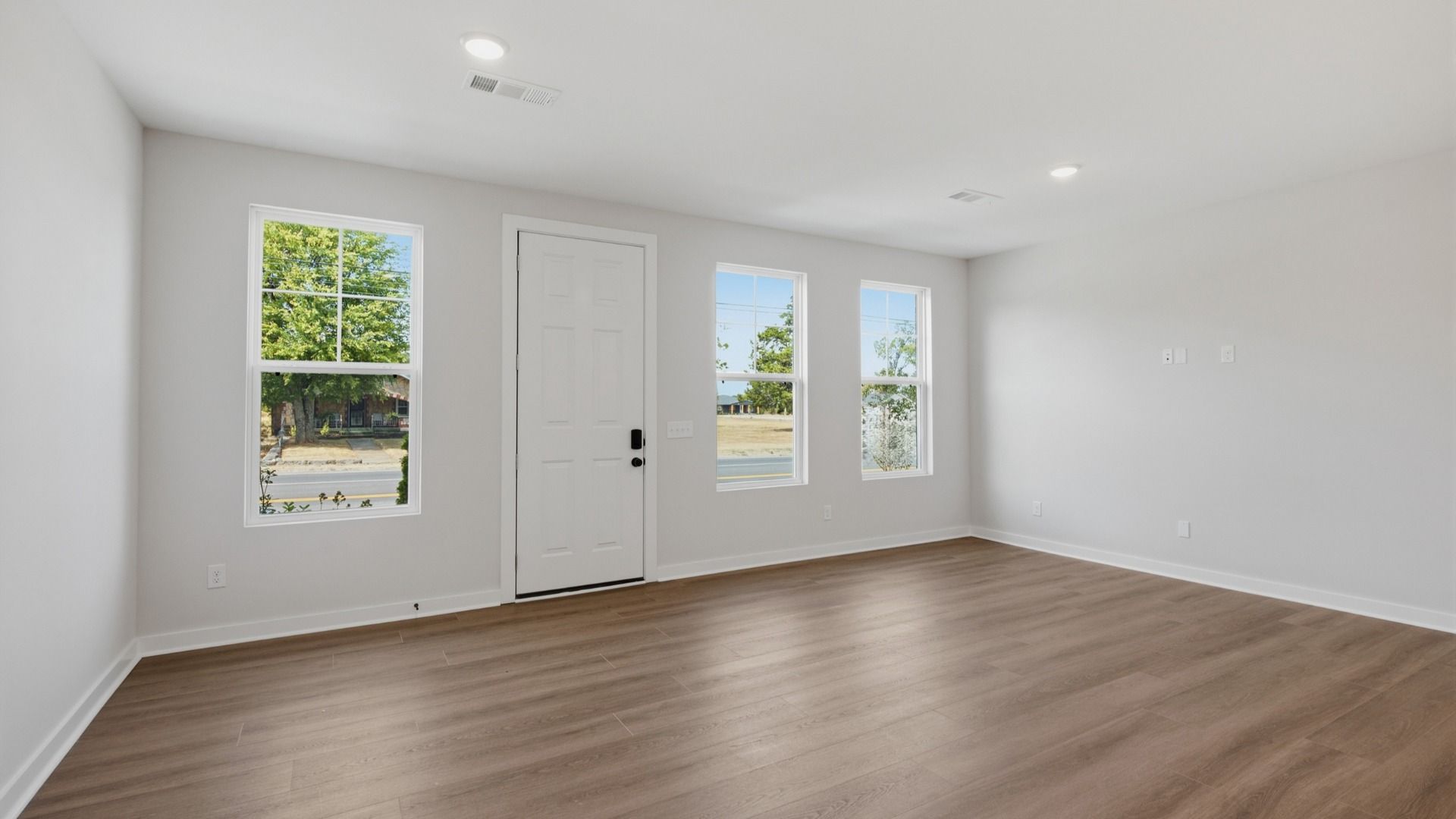 Front door with windows into spacious entryway