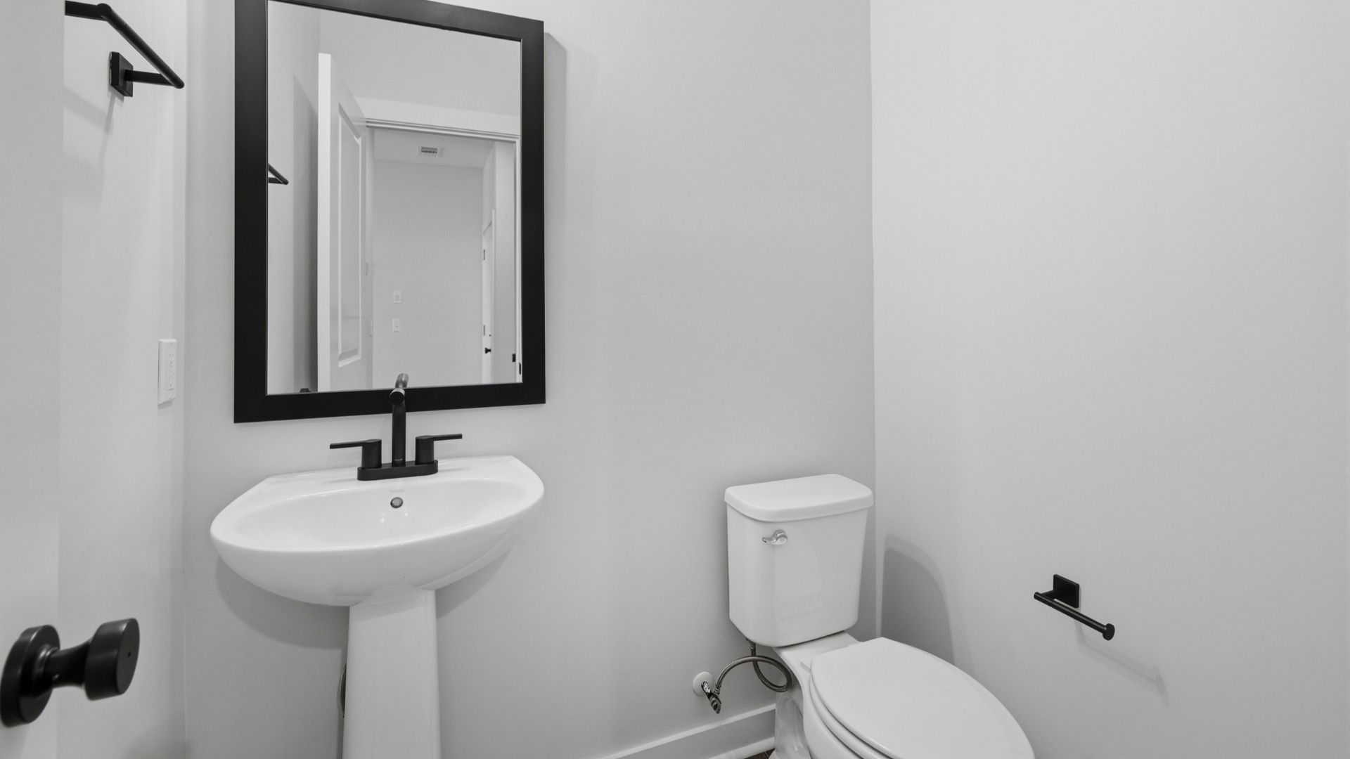 Bathroom with mirror above sink