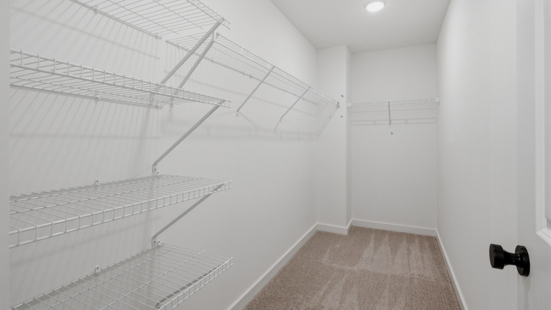 Elevated walk-in closet right off the primary bathroom