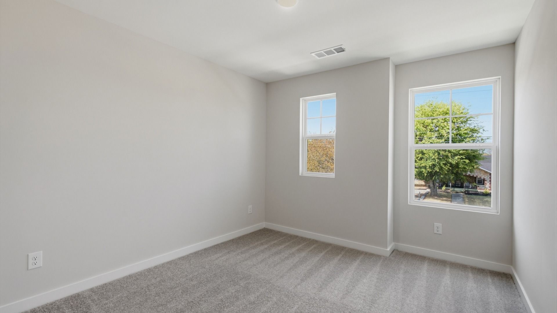 Seperate secondary bedroom with upstairs view of community