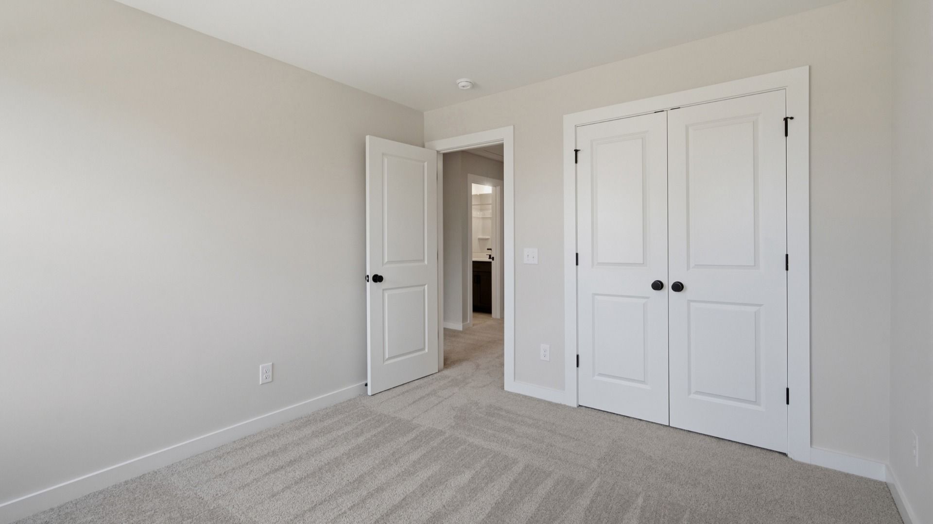 Secondary bedroom with double door closet for storage options