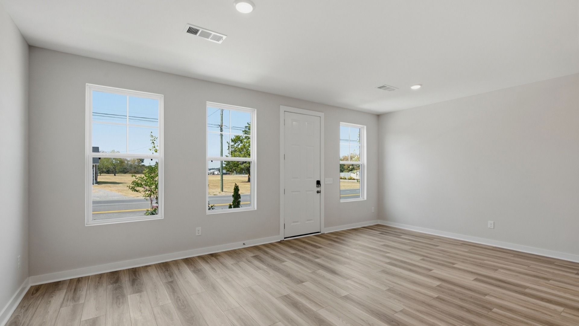Front door with windows into spacious entryway