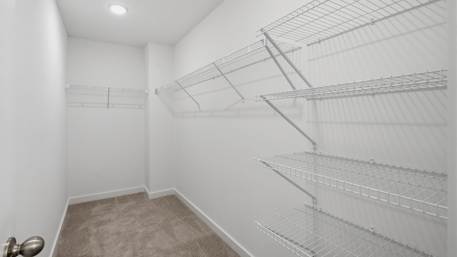 Elevated walk-in closet right off the primary bathroom