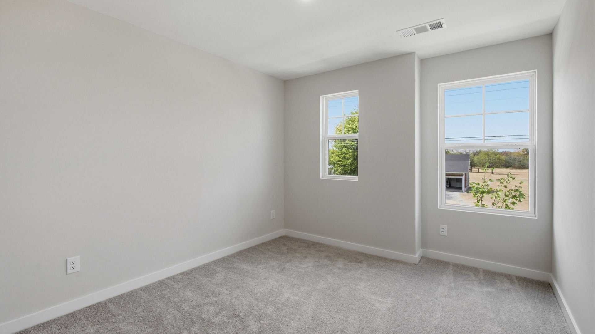 Separate secondary bedroom with upstairs view of community