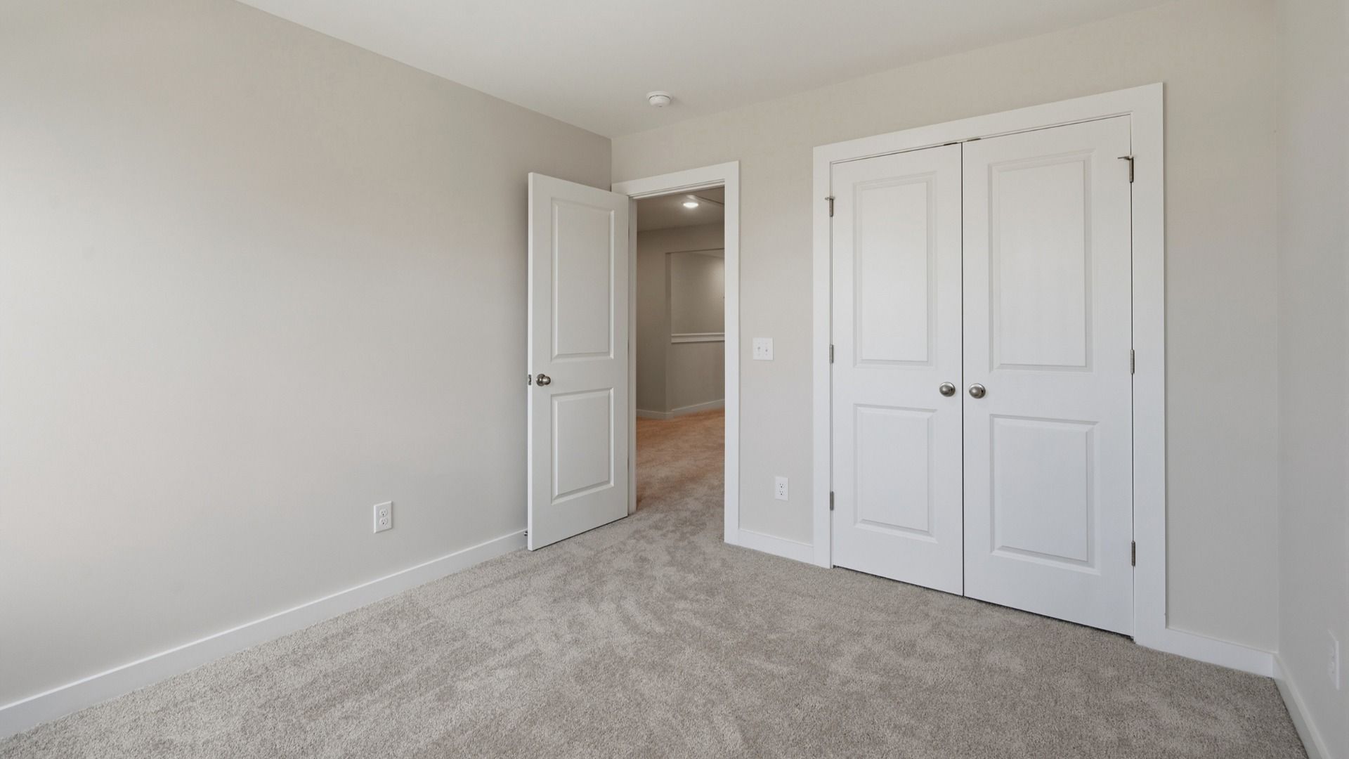 Secondary bedroom with double door closet for storage options