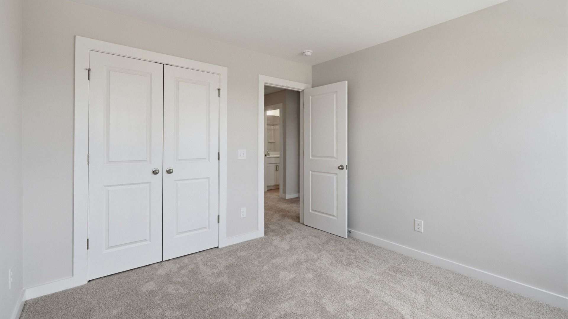 Secondary bedroom with double door closet for storage options