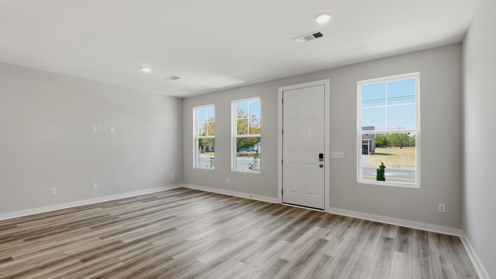 Spacious entrance with hard surface flooring