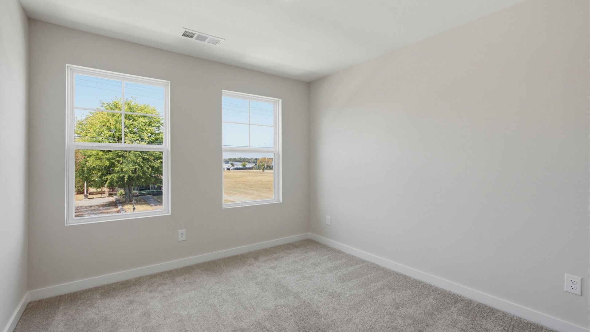 Secondary bedrooms with windows for view of community