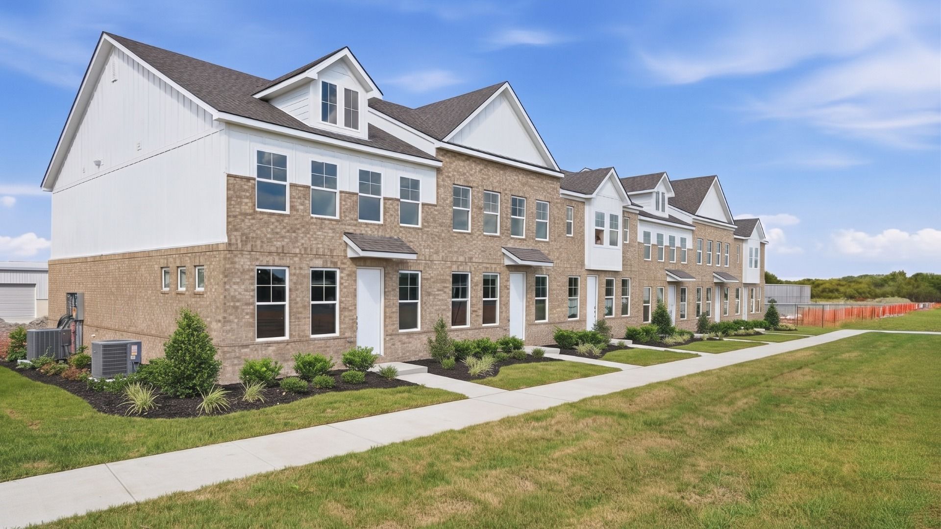 Enhanced Image of the second townhome building at Hartmann Landing, representative of a completed project