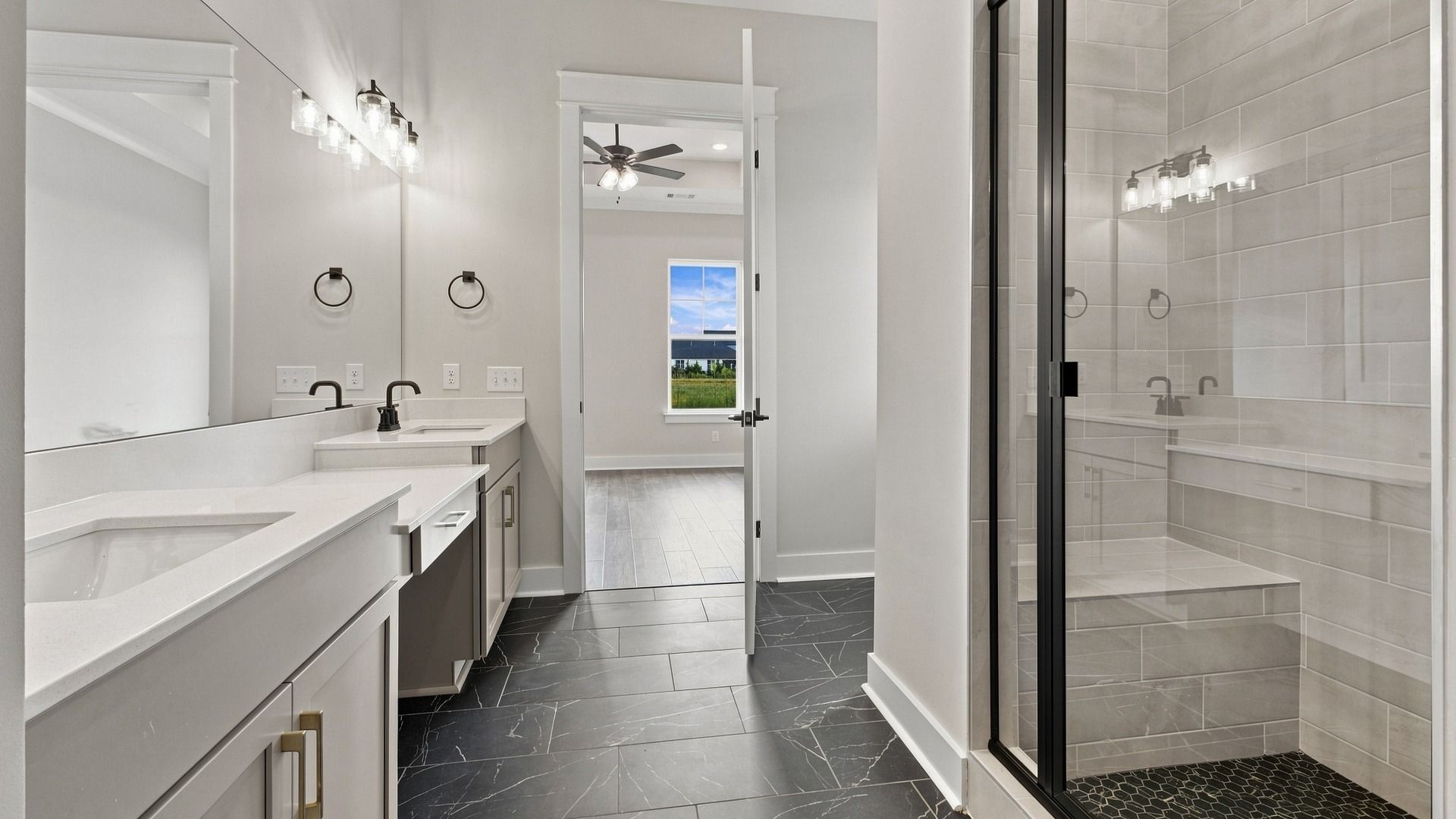 Primary Bathroom suites with luxury tile finishes