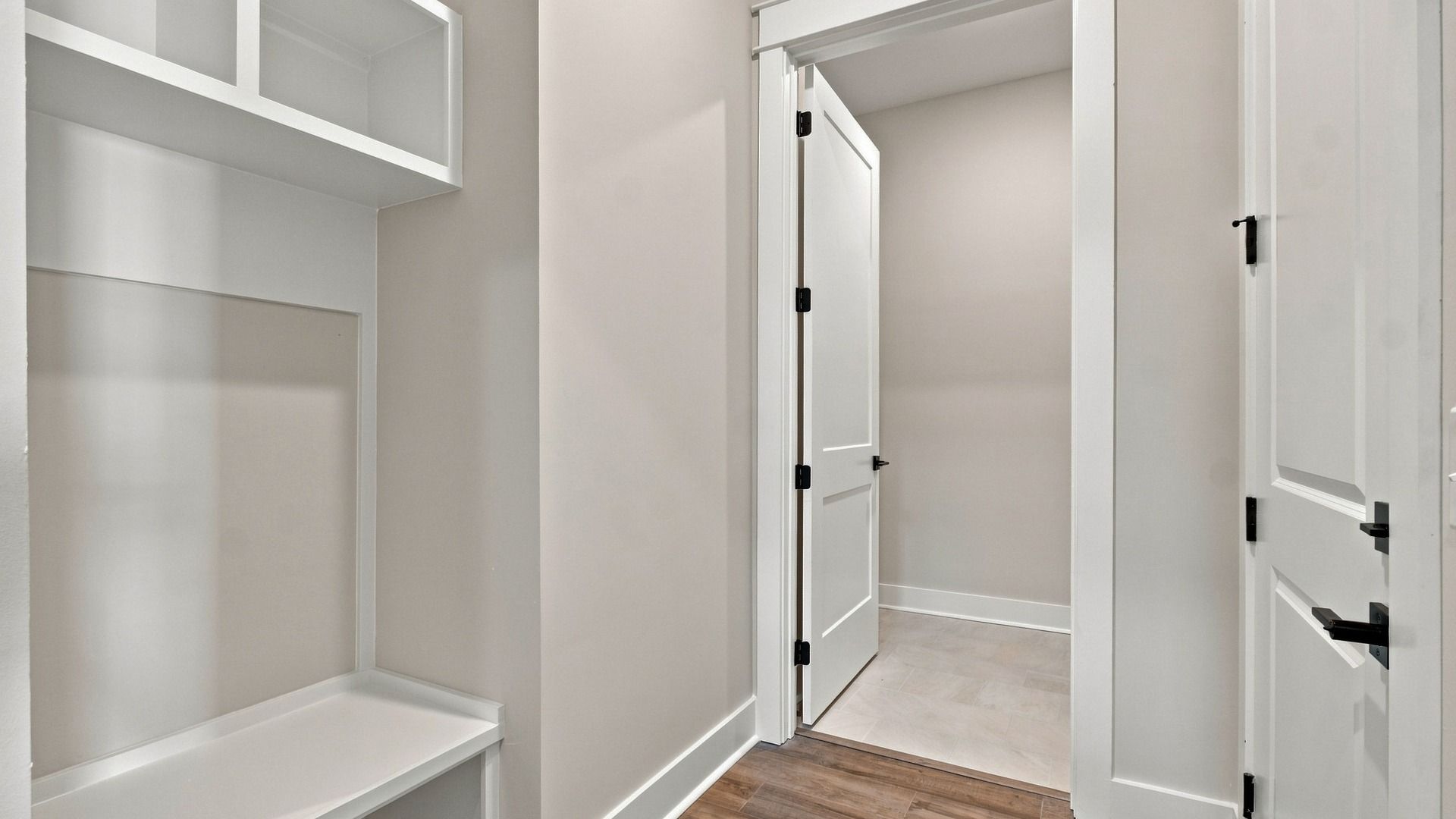 MDF built and painted drop zone bench and cubbies near garage entry for your convenience
