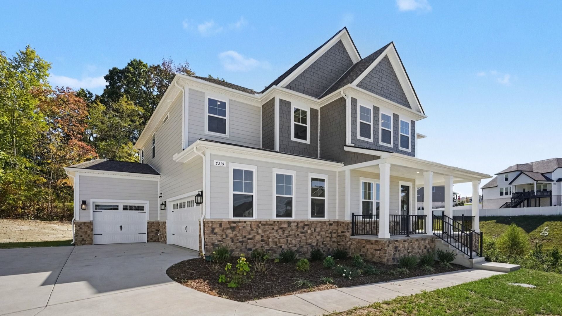 Front exterior of beautiful two-story home plan Solace II