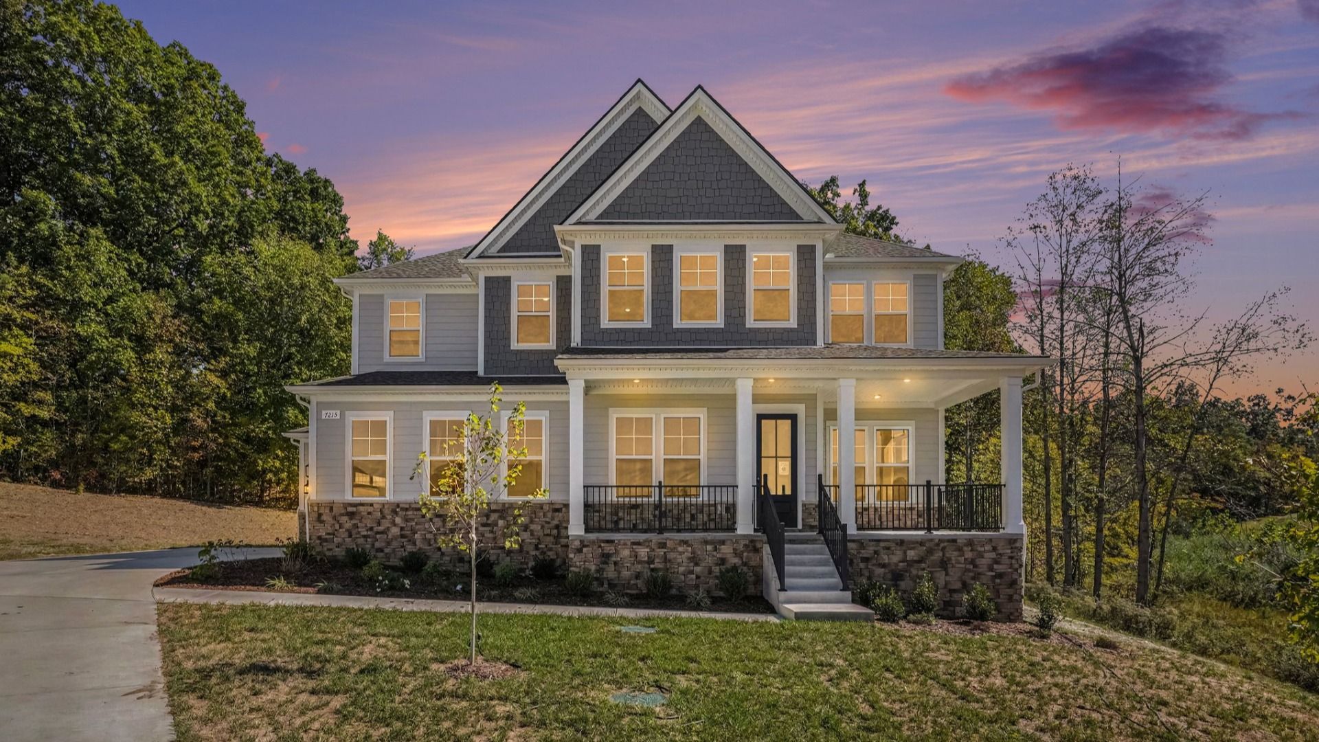 Front exterior of beautiful two-story home plan Solace II