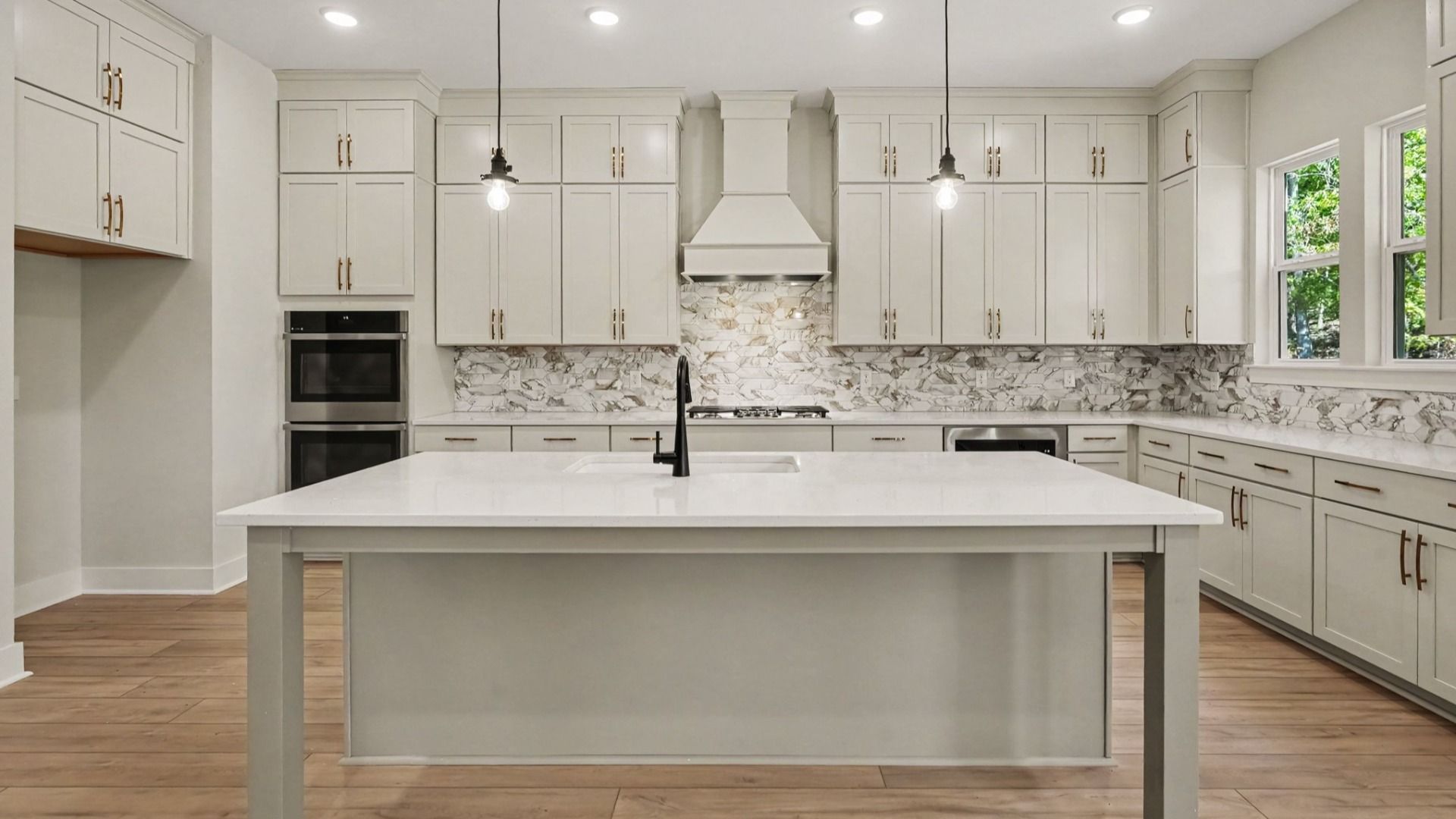 Elevated kitchen features in the Solace II home plan such as a gourmet kitchen with various cabinets and island