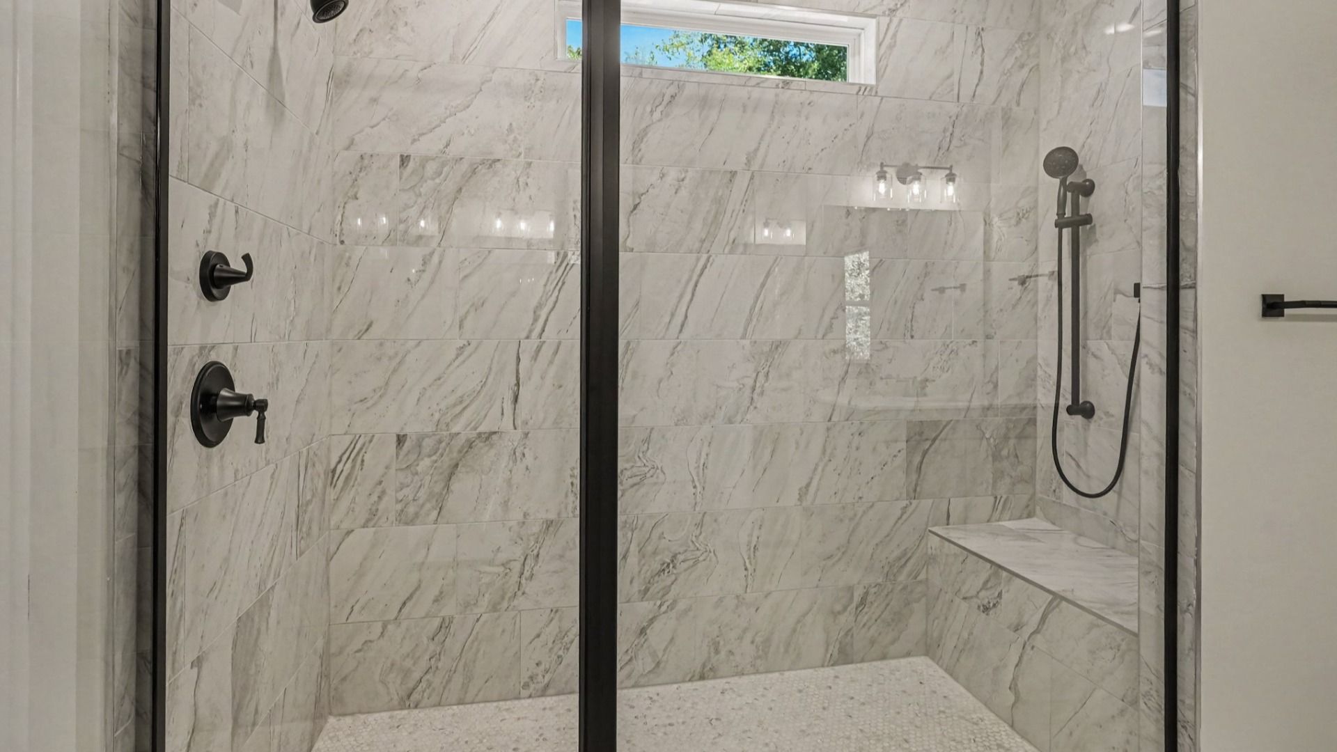 Roman shower in primary bathroom