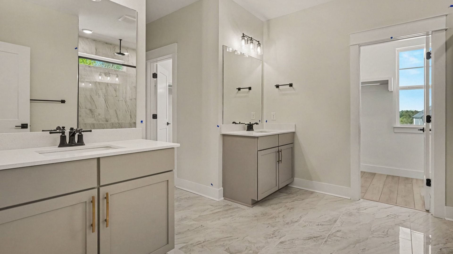 Primary bathroom with dual vanities