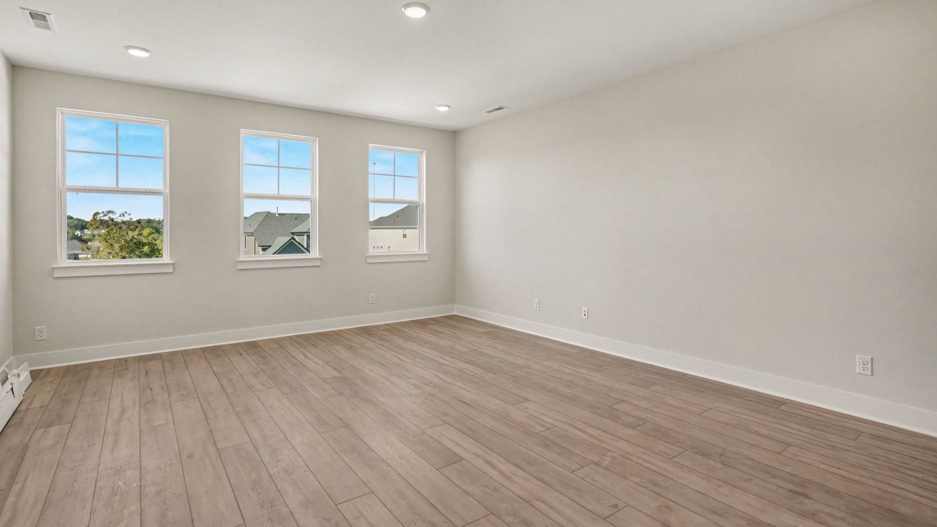 Natural light spills in this secondary bedroom with the Solace II  home plan
