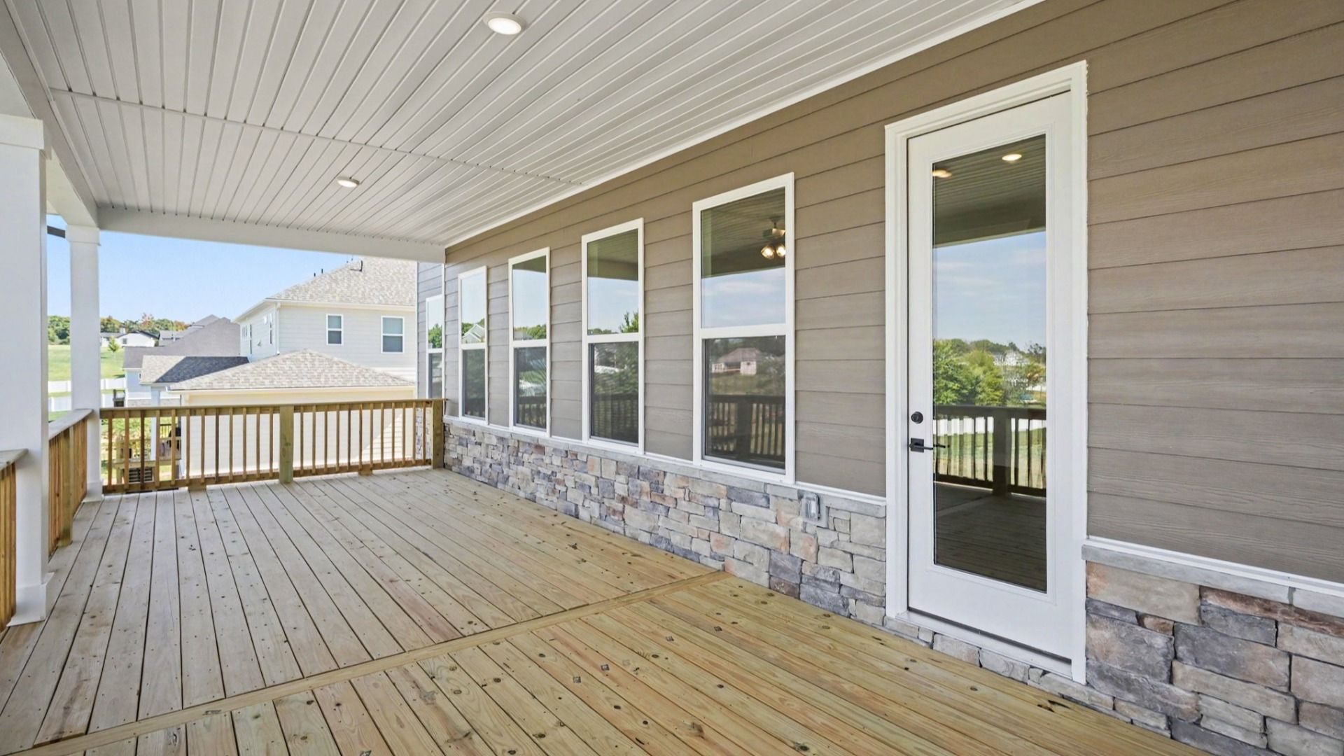 Expanded covered back porch perfect for hosting and outdoor activities