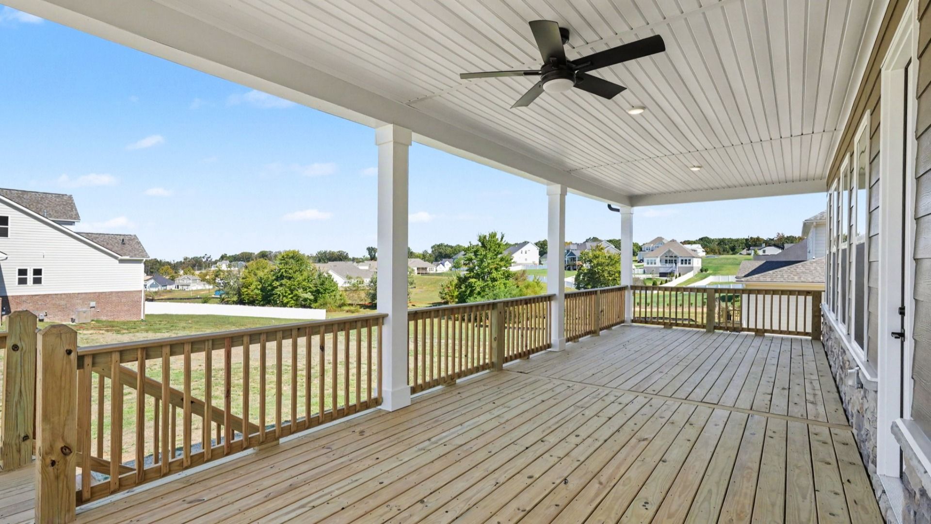 Expanded covered back porch perfect for hosting and outdoor activities
