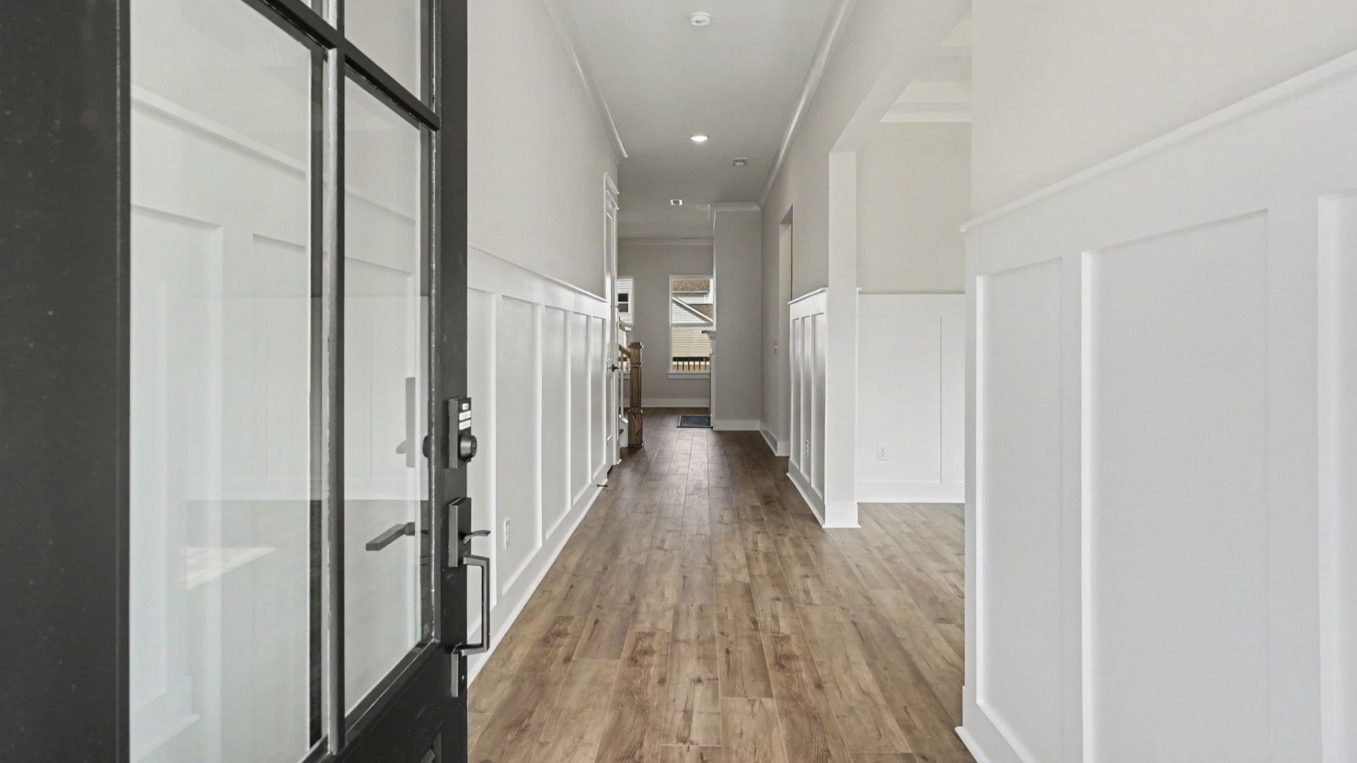 Front door hallway entrance right next to versatile loft space