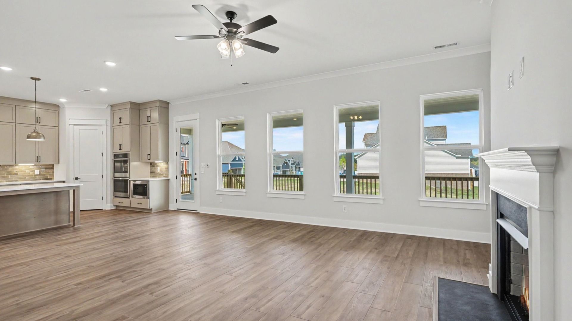 Natural lighting from windows shows the spacious living area