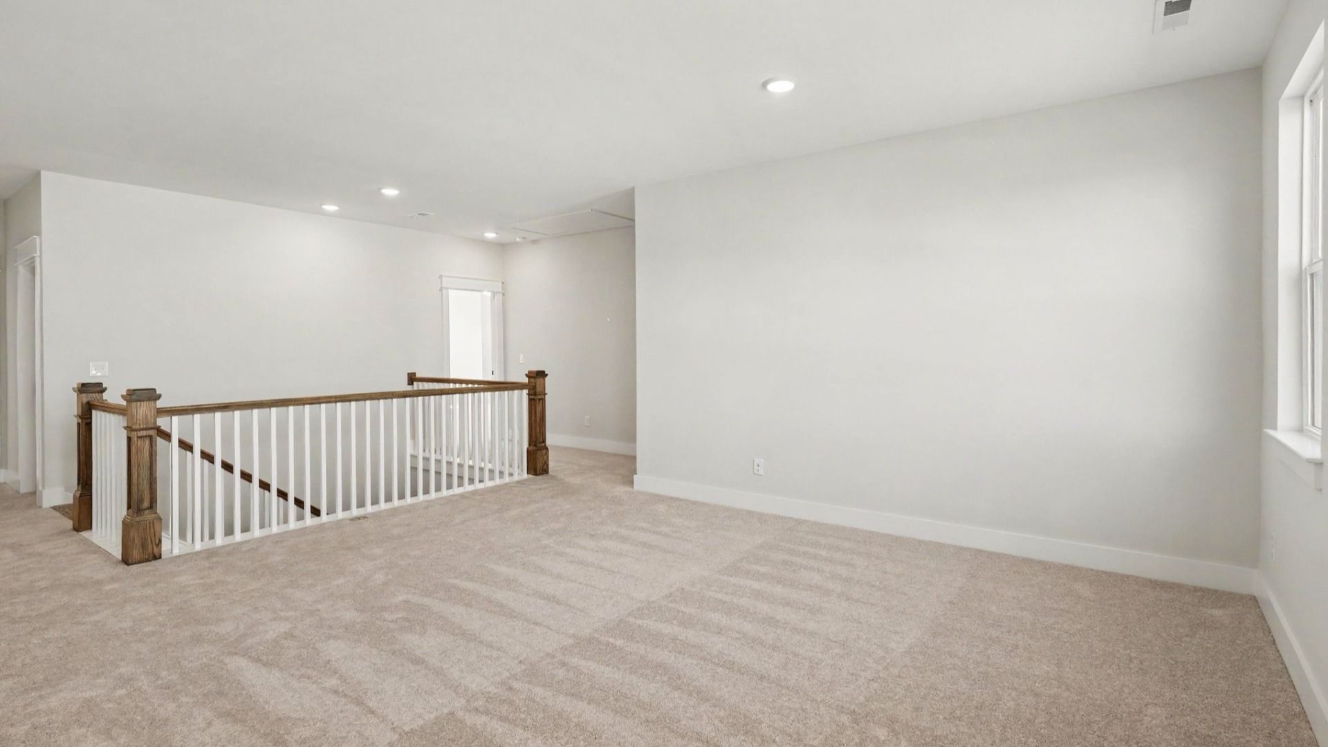 Versatile upstairs flex space by staircase