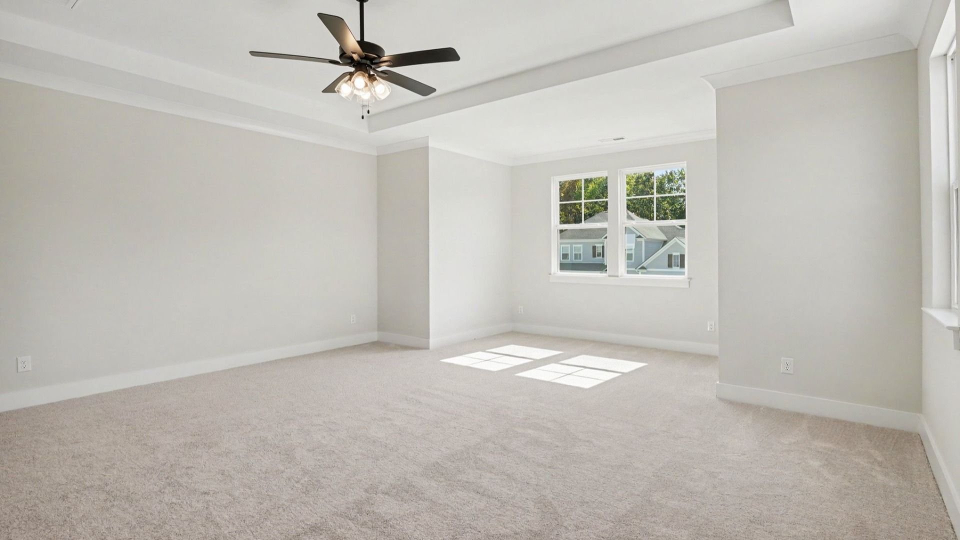 Dedicated sitting space in spacious primary bedroom