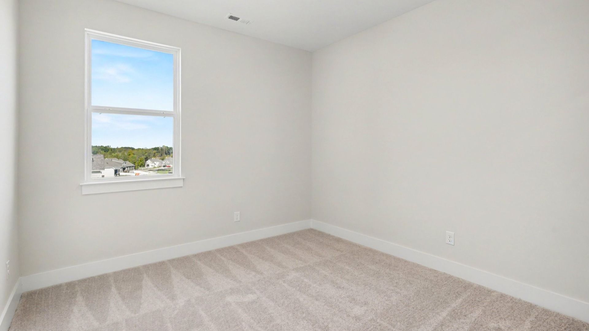 Secondary bedroom with walk-in closet