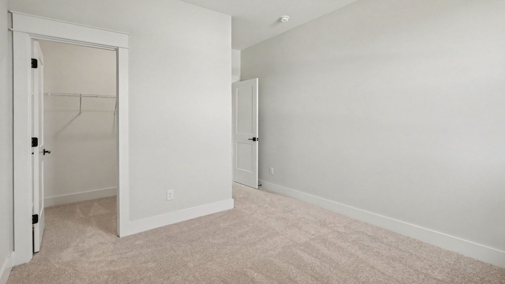 Secondary bedroom with walk-in closet