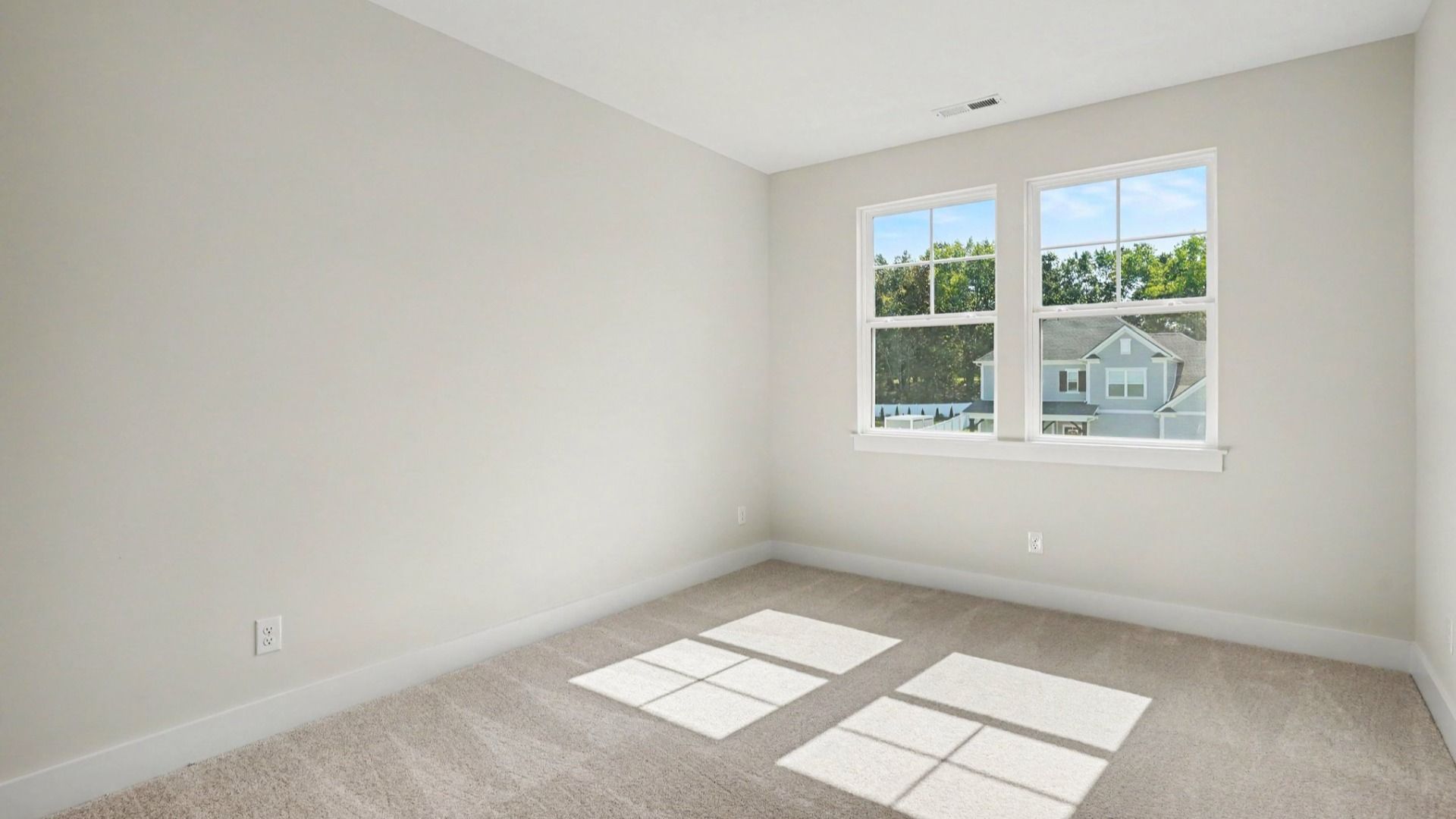 Separate secondary bedroom with view of community