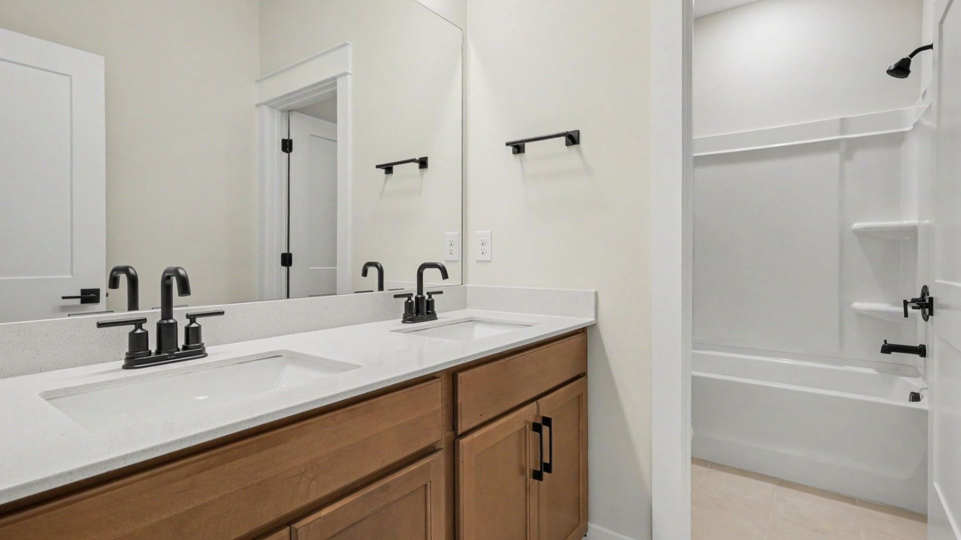 Bathroom with elevated features such as dual vanity and private shower/ bathtub