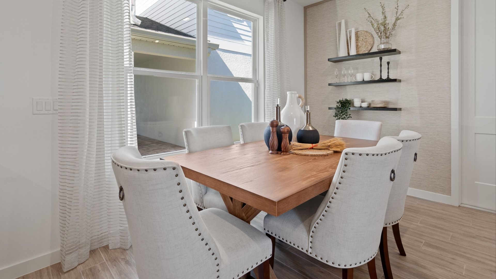 Cozy cafe with large double window in a DRB Home Clementine model at the Trinity Place community.