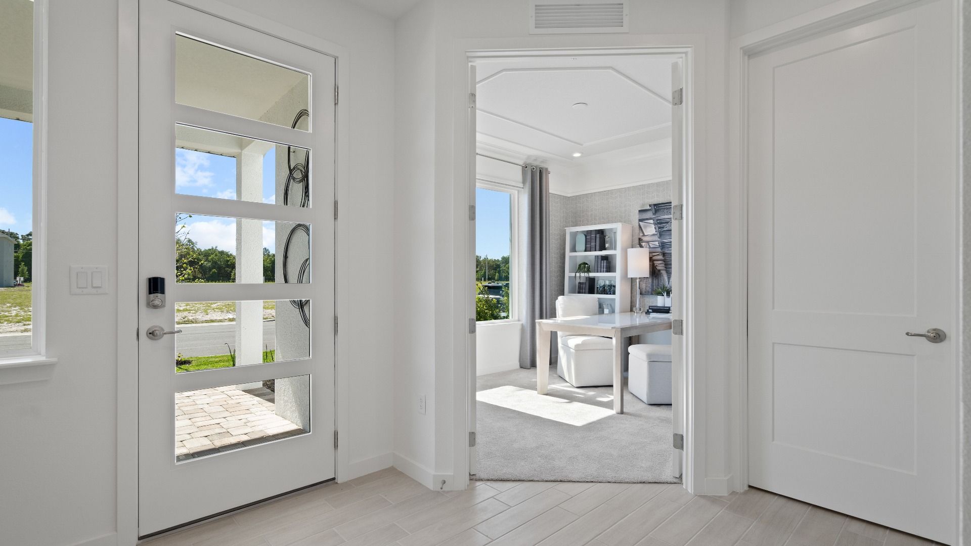 Front entry and adjacent private study at a DRB Homes Ambersweet model at the Trinity Place community.