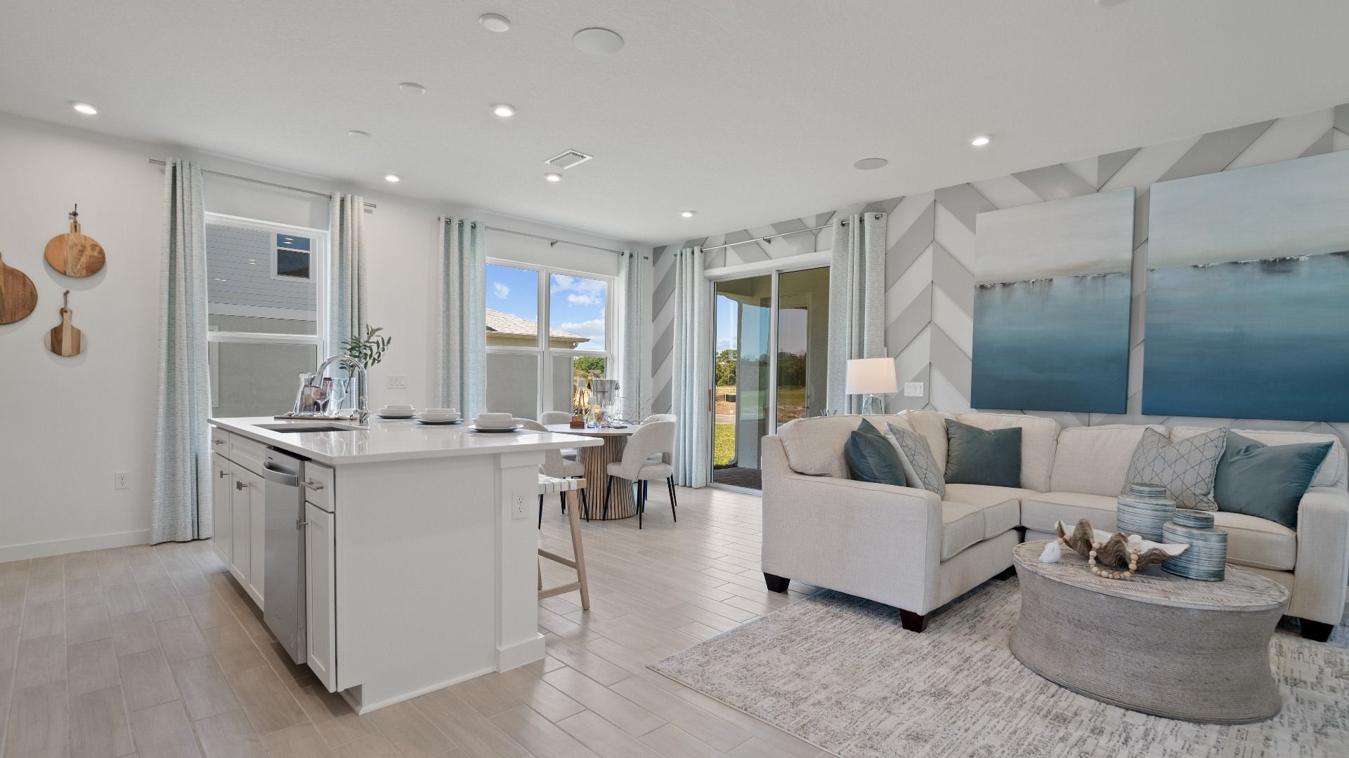 Open kitchen and family room at a DRB Homes Ambersweet model at the Trinity Place community.