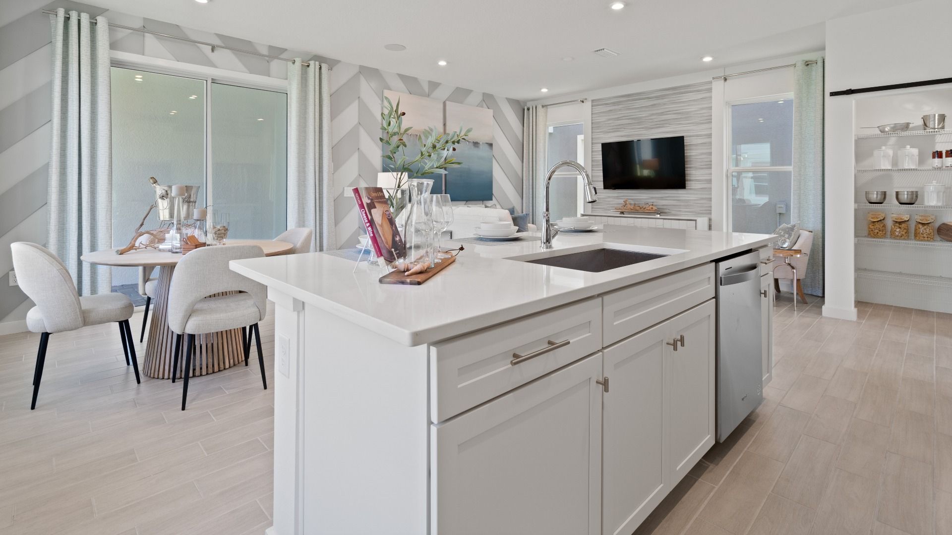 Open kitchen and breakfast area at a DRB Homes Ambersweet model at the Trinity Place community.