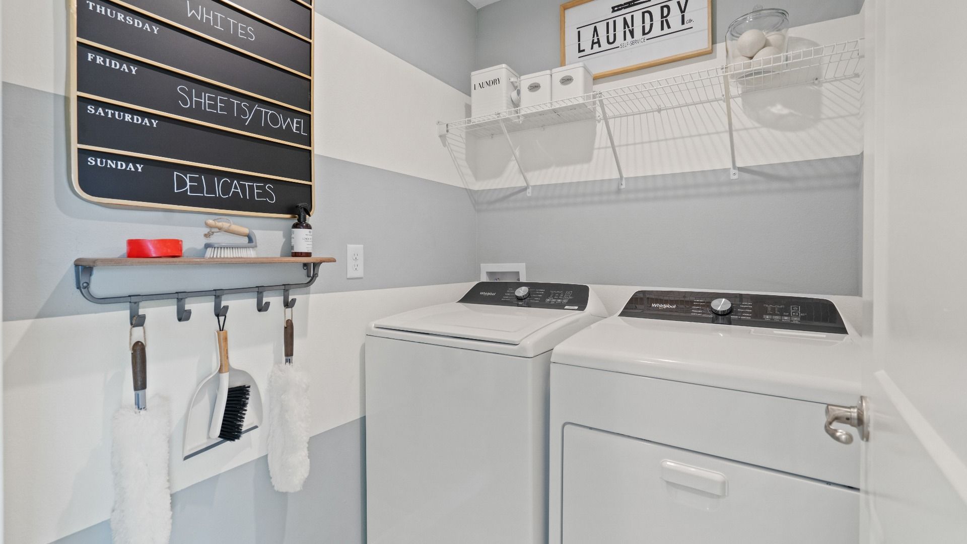 Bedroom level laundry room in a DRB Homes Ambersweet model at the Trinity Place community.
