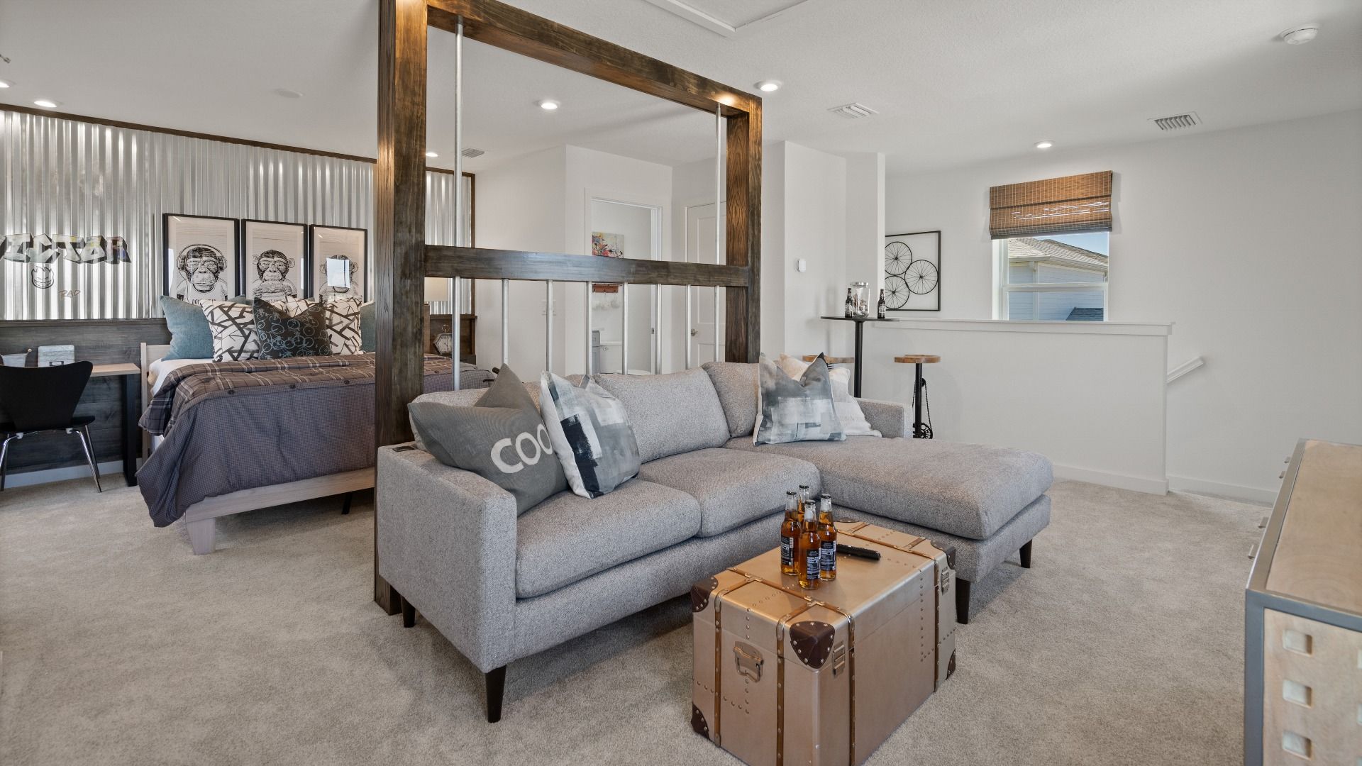 Above garage retreat space used as a family room and bedroom in a DRB Homes Ambersweet model at the Trinity Place community.