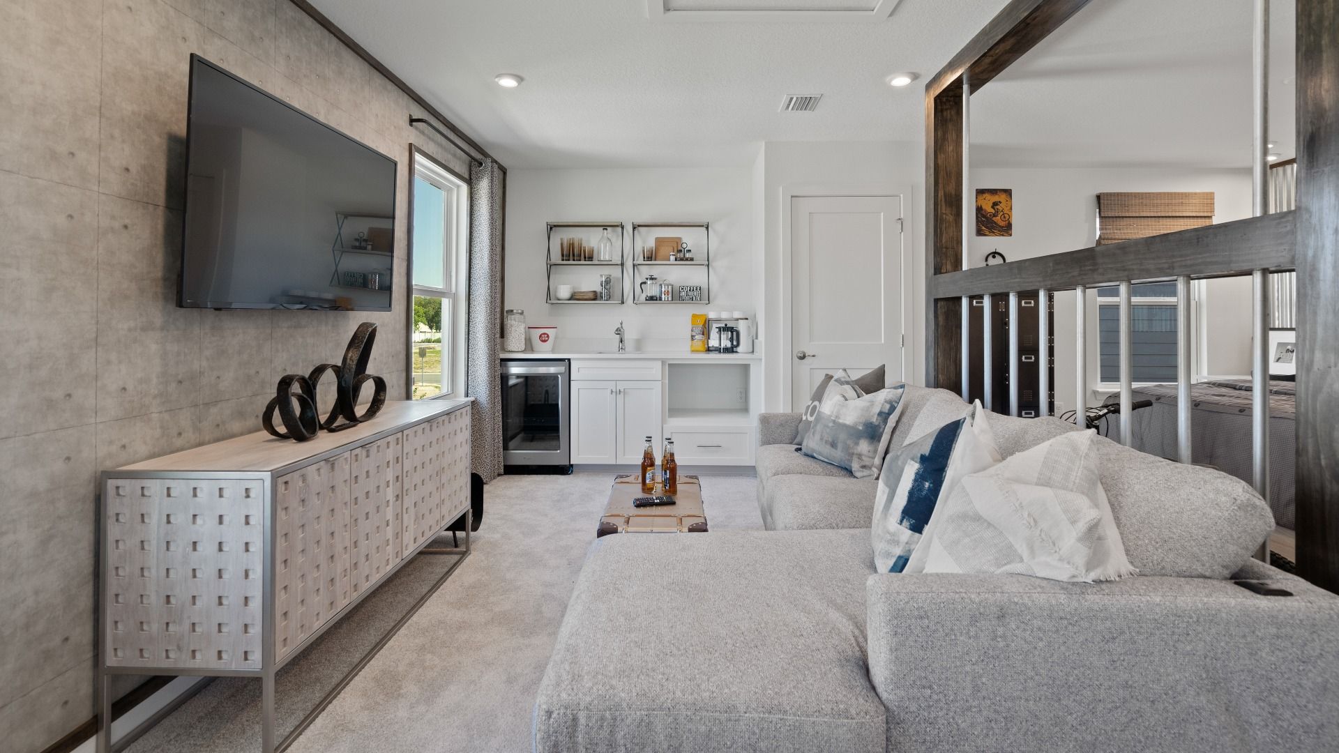 Above garage retreat space with wet bar in a DRB Homes Ambersweet model at the Trinity Place community.