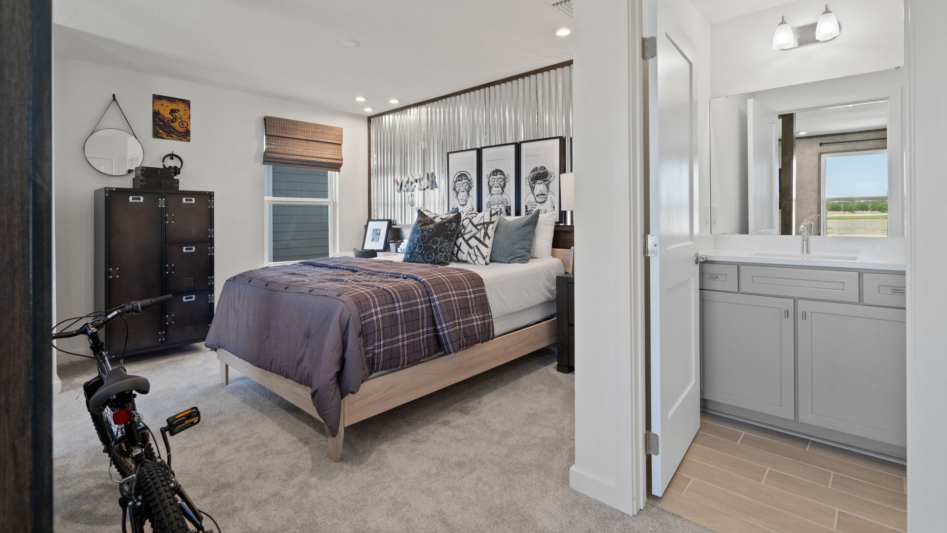 Above garage retreat space with full bathroom in a DRB Homes Ambersweet model at the Trinity Place community.