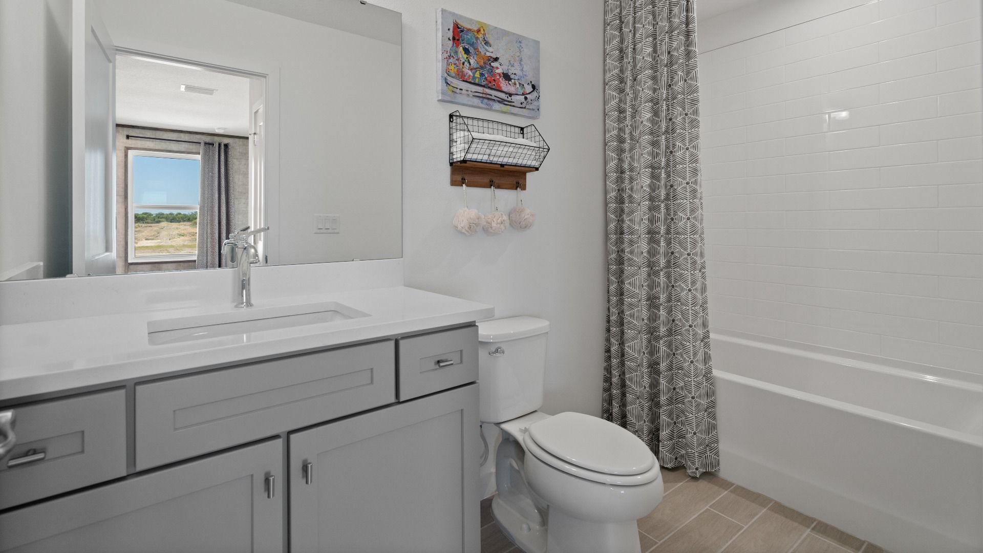 Above garage retreat full bathroom in a DRB Homes Ambersweet model at the Trinity Place community.
