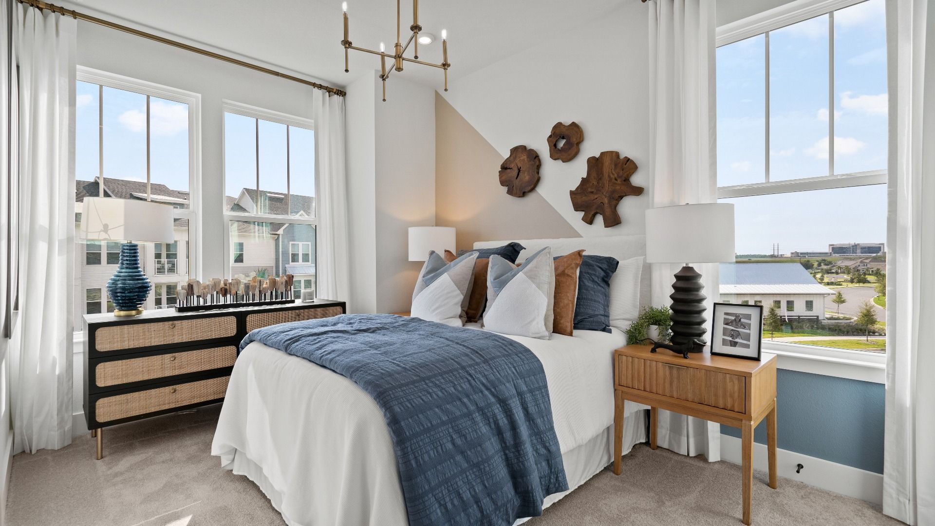 Bright and open secondary bedroom at DRB Homes, featuring two windows for plenty of natural light and versatile space!