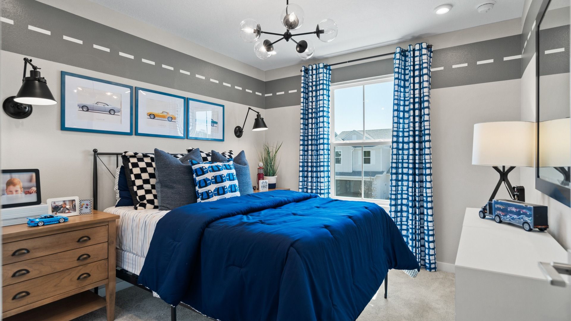 The second bedroom at Cyrene at Harmony by DRB Homes features a large window, bringing in natural light!